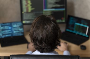 close up programmer sitting desk